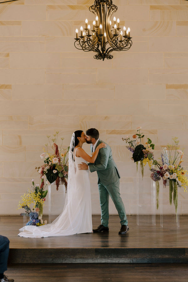 modern structural flowers on plinths for a ceremony with couple at peterson house wedding hunter valley