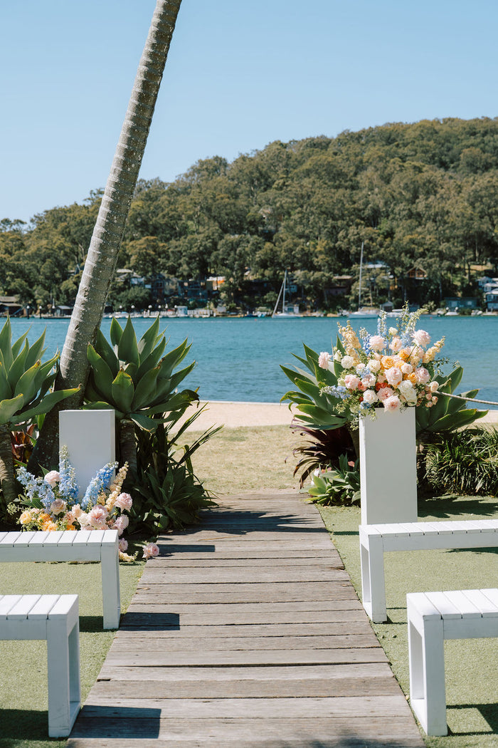 Waterfront lawn ceremony at Pasadena with plinth arrangements